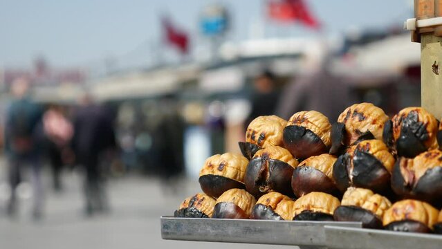traditional Istanbul street food grilled chestnuts in a row