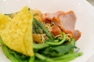 Photo of Chinese Noodles soup with Cha Siu, Wonton and Vegetables