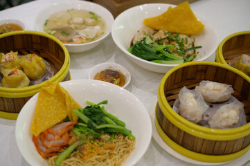 Chinese breakfast table with dim-sum and noodle  