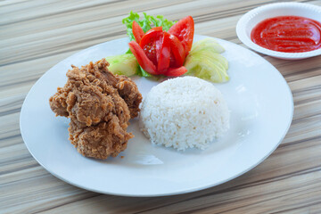Fried Chicken with white rice and Vegetables as garnish