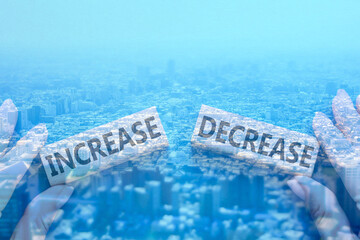 This image is a collage of a cityscape seen from above and an image of rising interest rates. The...