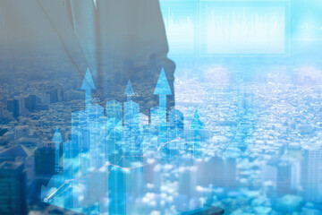 This image is a collage of a cityscape seen from above and an image of rising interest rates. The...