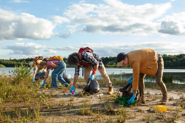 A diligent team works together to clean a lake's shore, contributing to environmental conservation....
