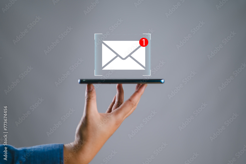 Poster hand holding the smartphone shows the icon for new email, send an information message email. smart s