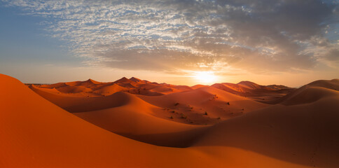 Beautiful sand dunes in the Sahara desert with amazing cloudy sky - Sahara, Morocco