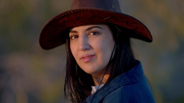 Close up shot of a young woman in a western style outfit in the Arizona desert - travel photography