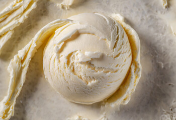 Vanilla ice cream scooped out of container
