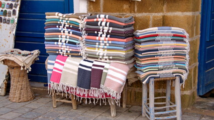 Pile of colorful textiles for sale in the medina in Essaouira, Morocco