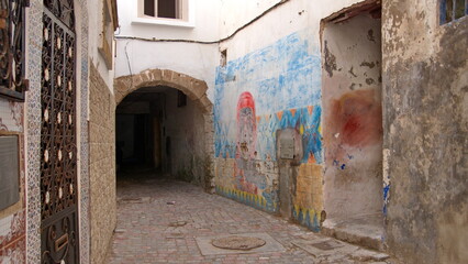 Alley passing beneath a building in the medina in Essaouira, Morocco