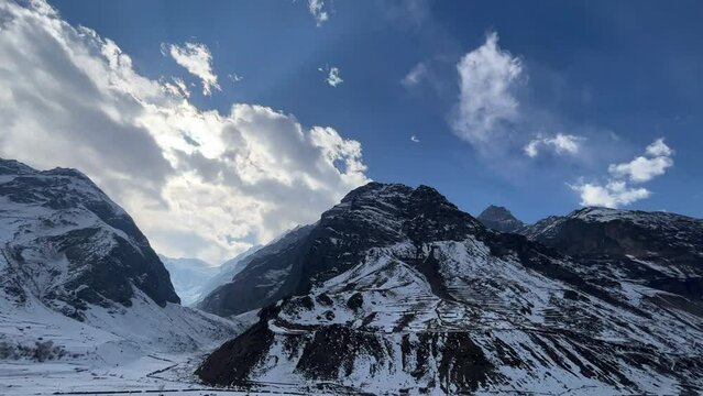 Snow filled mountains with blue skies landscape near Manali Kashmir Rothang pass India