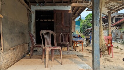 Fototapeta na wymiar Chair in a old street