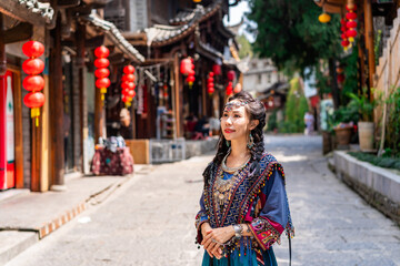 Young female tourist in traditional dress walking at Furong old Town, The famous tourist destination at Hunan Province, China - 773703413