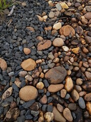 abstract Textured background with round pebble stones. Vacation holiday recreation on beach concept. High quality photo. Fragment with a texture of rock.