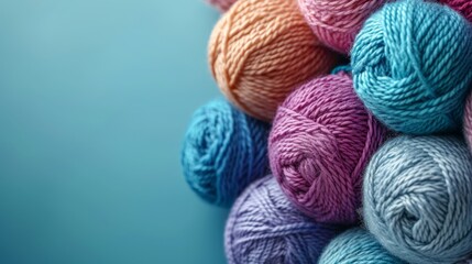   A multicolored yarn ball on a blue background with soft focus