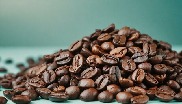 Close-up of roasted coffee beans on a wooden table, showcasing their rich color and texture