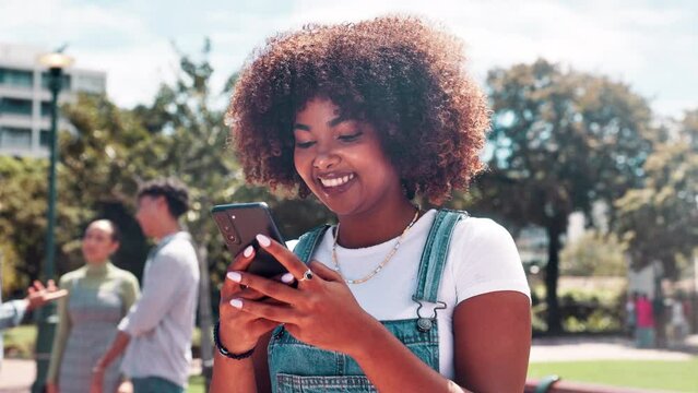 Black woman, student and afro with phone at university for social media, communication or networking in nature. Happy African or female person with smile on mobile smartphone for online chatting