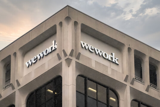 Vancouver, British Columbia, Canada. Mar 27, 2024. A Wework sign at the top of a building in downtown Vancouver.