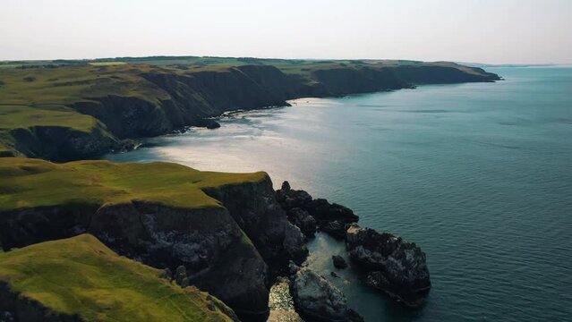 Sweeping Aerial Views of the Britain's Coastline, Cliffside Beauty of St Abbs Head, Rugged Cliffs in Rural Scotland, British Isles.