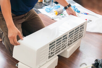 Technician man install new air conditioner, Repairman service for repair and maintenance of air...