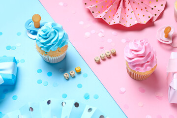 Delicious cupcakes with gift boxes, decorations and text BOY GIRL on color background. Gender reveal party concept