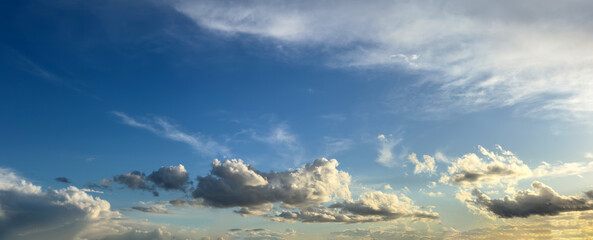 White grey fluffy cloud in many shape on blue sky background texture. Wallpaper, banner. Copy space