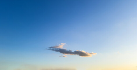 Lonely fluffy cloud isolated on clear sky background. Galloping horse cloud shape. Wallpaper, Space