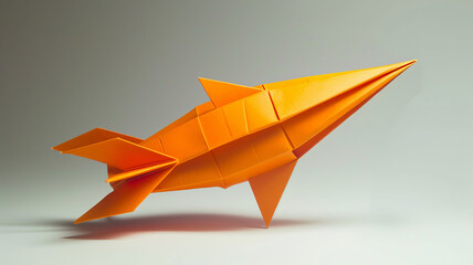 Handcrafted orange origami rocket on neutral backdrop AI Generative.