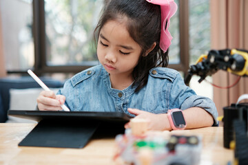 Young Girl Drawing on Digital Tablet with Stylus Pen