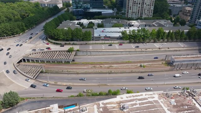 Vehicles Driving Through Lenox Road And T. Harvey Mathis Parkway In Buckhead,  Atlanta, Georgia. - aerial shot