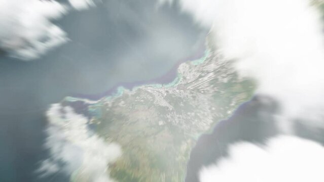 Earth zoom in from space to Hagatna, Guam. Followed by zoom out through clouds and atmosphere into space. Satellite view. Travel intro. Images from NASA