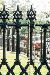Wrought iron fence with stand of Mardi Gras beads, New Orleans