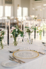 Luxurious wedding table with gold accents and florals