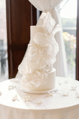 Fototapeta premium High-end wedding cake with artistic sugar veil detail