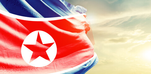 North Korea national flag waving in the sky. - obrazy, fototapety, plakaty