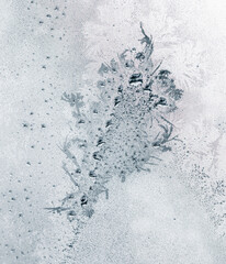 Frosty patterns on the window glass as a background