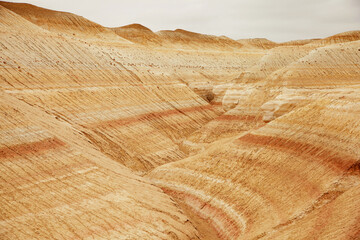 Unique geological feature known as tiger-striped mountains, showcasing layers of sedimentary rock...