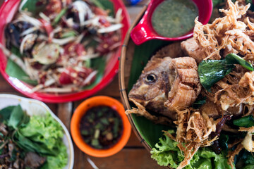 Crispy tilapia fish cooked with herbs, lemongrass, kaffir and lime leaves served with seafood sauces.