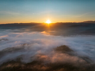Fototapeta na wymiar Beautiful morning Sunrise and Fog flow over mountain in Ai yerweng, Yala, Thailand