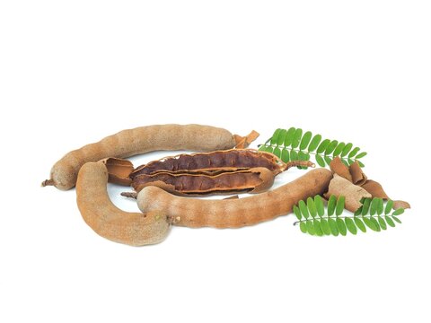 Fresh and perfectly ripe sweet tamarind. Placed isolated on a white background.	