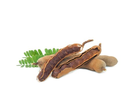 Fresh and perfectly ripe sweet tamarind. Placed isolated on a white background.	