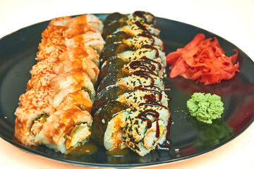 Fresh delicious sushi set with red fish delivered to home, office