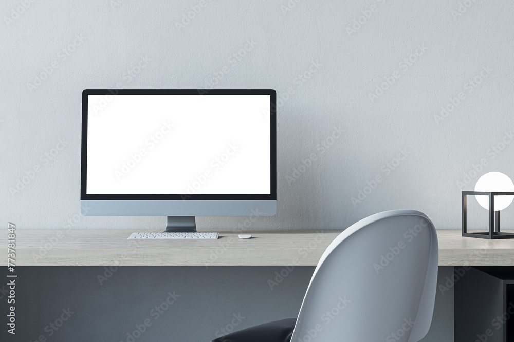 Poster Close up of empty white mock up computer screen at modern designer office workplace in interior. Concrete wall background. 3D Rendering.