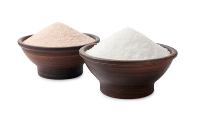 Different types of natural salt in bowls isolated on white