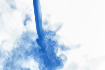 Puffs of paint in water. The dissolution of the dye in water. Water pollution. Concept art...