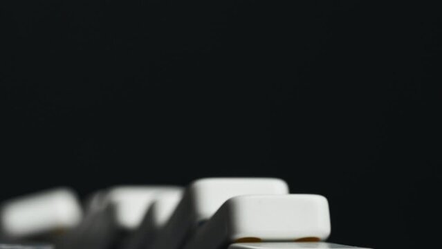 Close-Up View of Dominoes Lined Up Before Toppling Sequence in Studio