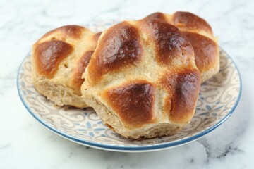 Hot cross buns on white marble table, closeup