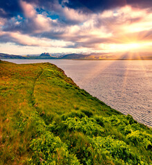 Dramatic Icelandic landscape with volcanic mountains on Atlantic ocean coast. Dramatic summer sunrise on the west coast of Iceland, Europe. Beauty of nature concept background.