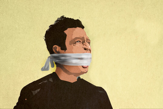 Man with mouth gagged by cloth against yellow background