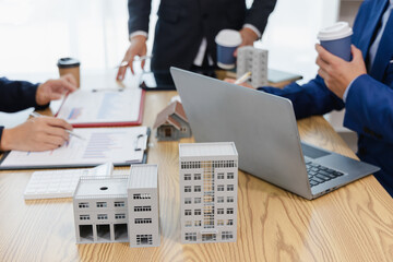 Business meeting of real estate brokers Business working on new startup project, analysis plan,...