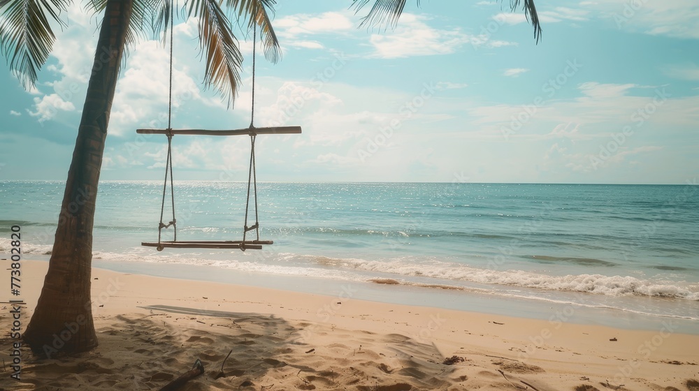Poster beachside swing a simple swing hanging from a palm tree on a sandy beach providing a tranquil and no